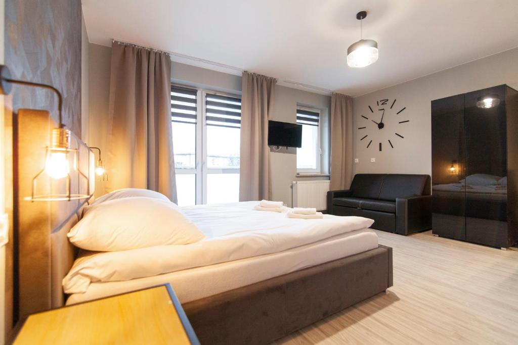 Posteľ alebo postele v izbe v ubytovaní Apartamenty Białystok - Botaniczna 9A/21