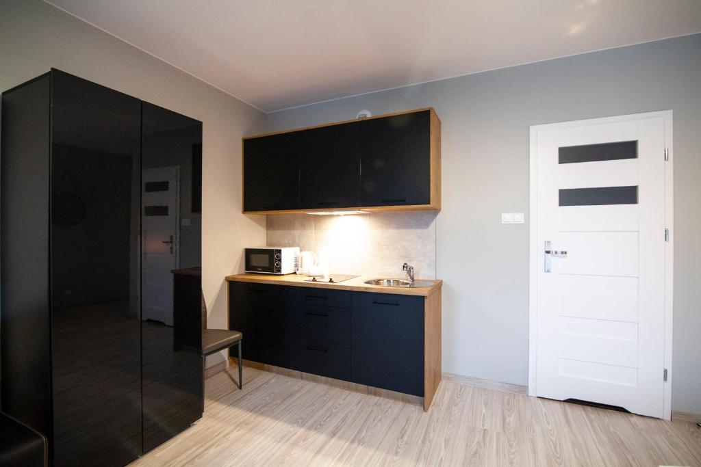 Kuchyňa alebo kuchynka v ubytovaní Apartamenty Białystok - Botaniczna 9A/21