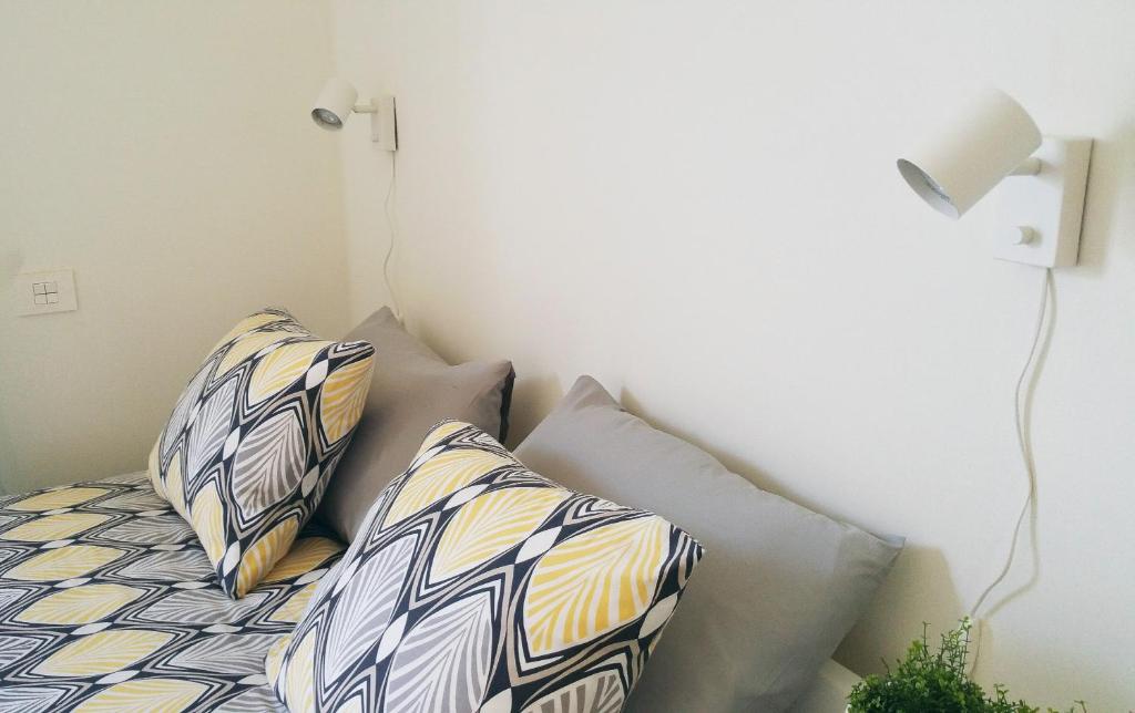 Postel nebo postele na pokoji v ubytování Le Suite Studio 491