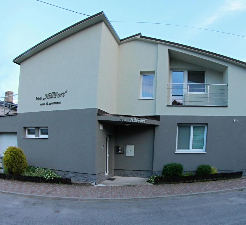 a building on a street in front of a building at Apartmány Hillfort in Bojnice