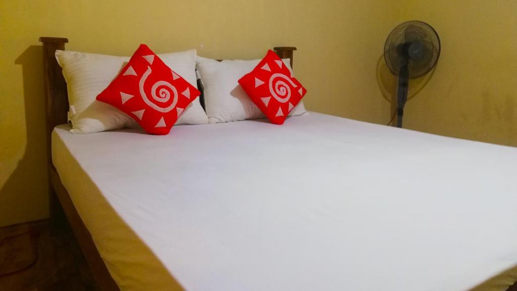 Postel nebo postele na pokoji v ubytování Pinthu Home Stay