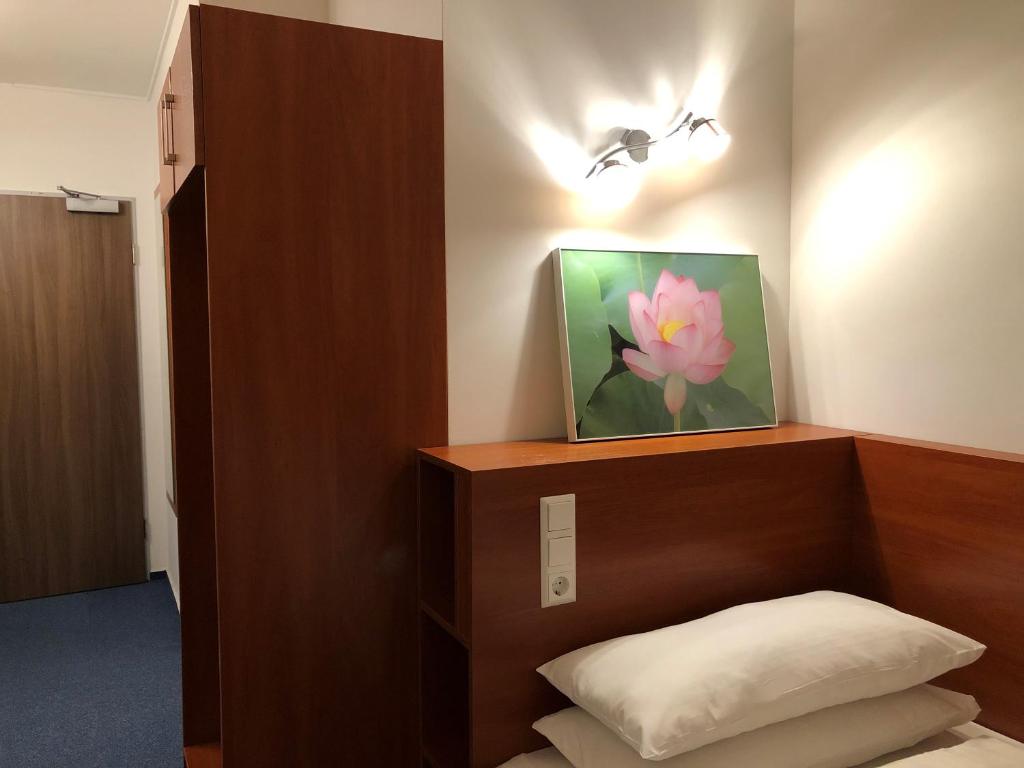 Postel nebo postele na pokoji v ubytování Hotel Mirabell