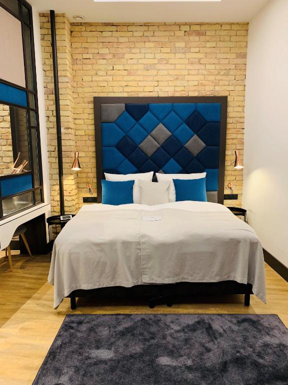 Postel nebo postele na pokoji v ubytování The Loft Budapest