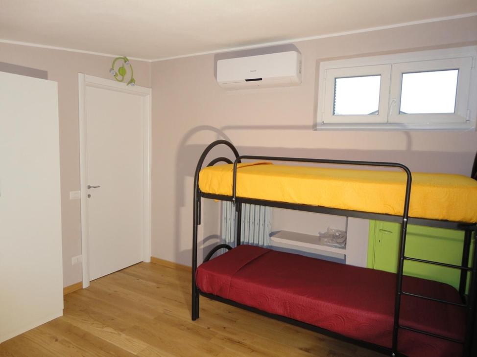 Postel nebo postele na pokoji v ubytování Pavia Ostello