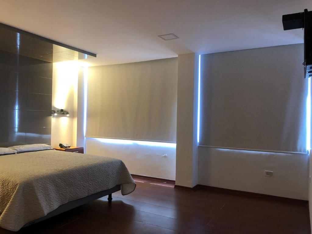 Postel nebo postele na pokoji v ubytování Hotel Bacastell
