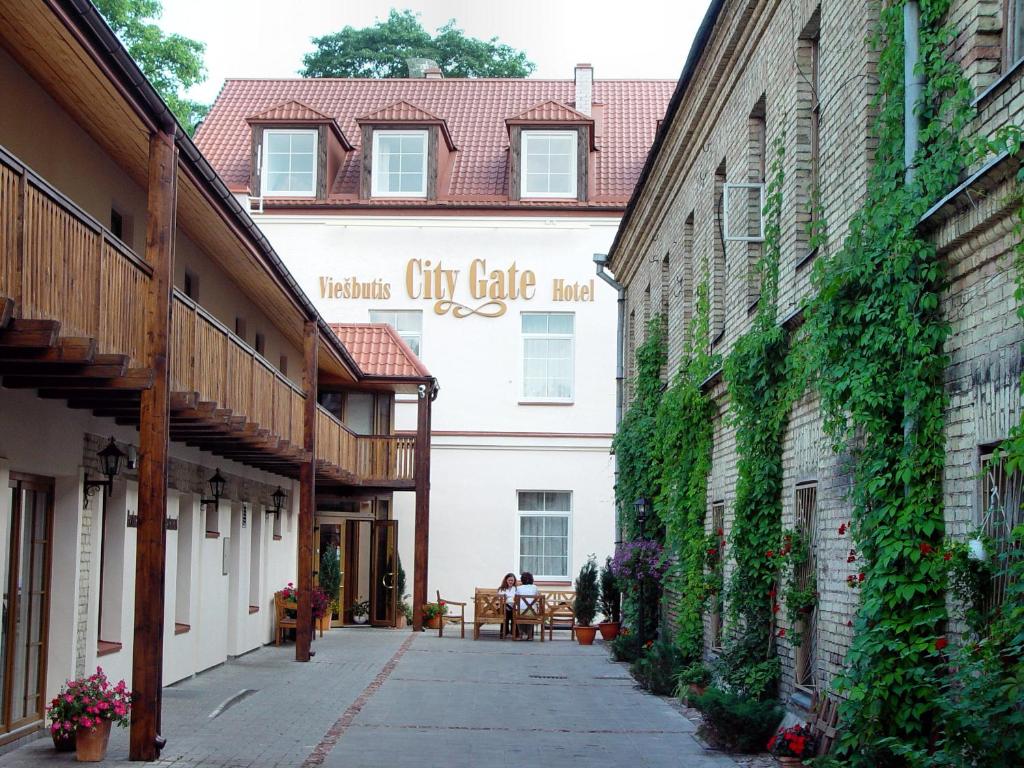 a building with a sign on the side of it at City Gate in Vilnius