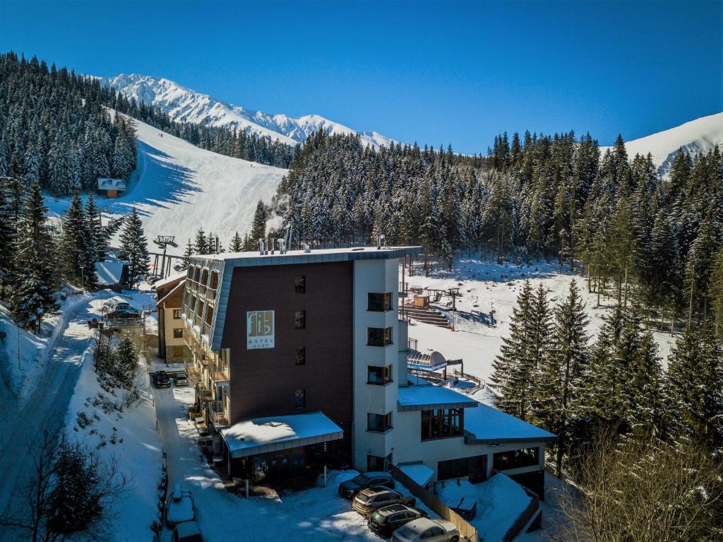 an aerial view of a hotel in the snow at Hotel FIS Jasná in Demanovska Dolina