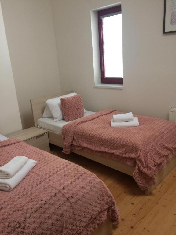 Postel nebo postele na pokoji v ubytování Horský Chalet Harrachov