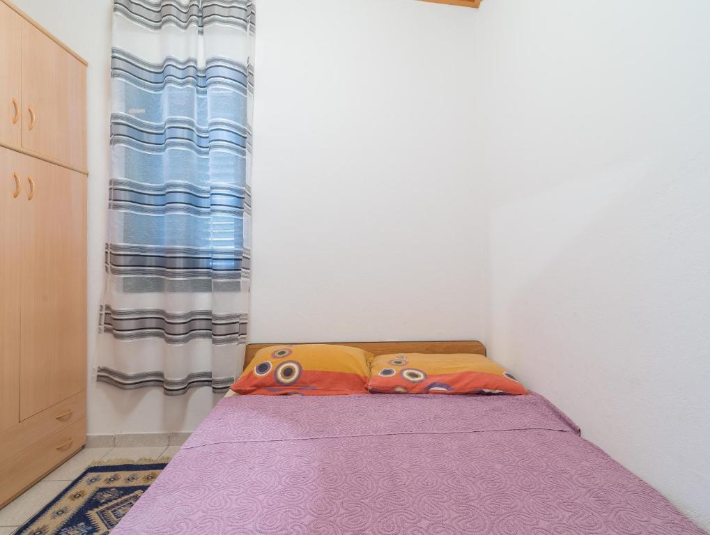 Łóżko lub łóżka w pokoju w obiekcie Apartments Domi
