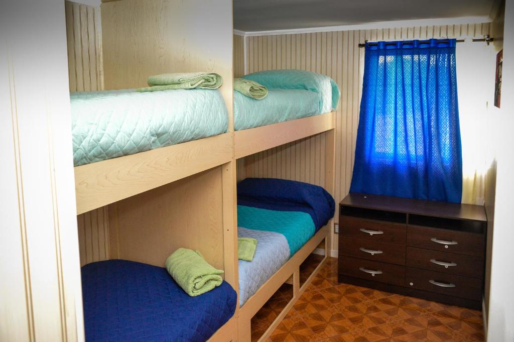 Postel nebo postele na pokoji v ubytování Marina Pichilemu