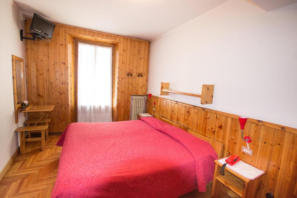 Postel nebo postele na pokoji v ubytování Meublé Albergo Dante