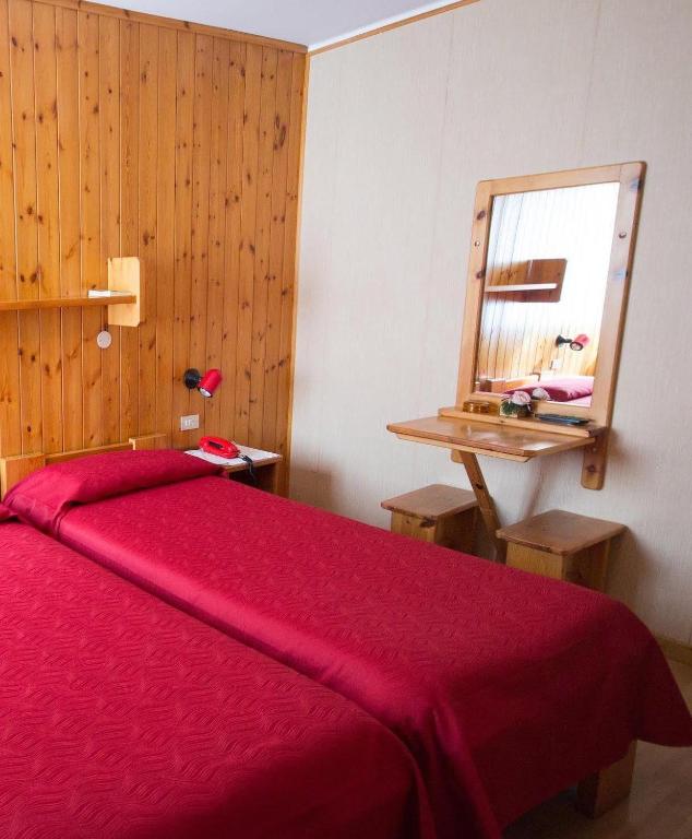 Postel nebo postele na pokoji v ubytování Meublé Albergo Dante