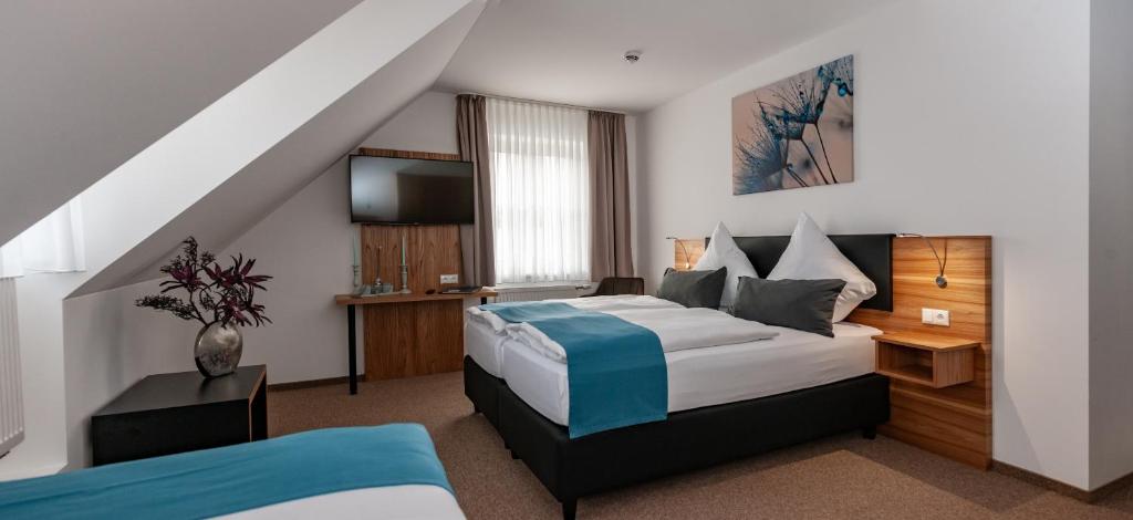 Ένα ή περισσότερα κρεβάτια σε δωμάτιο στο Hotel Drei Tannen