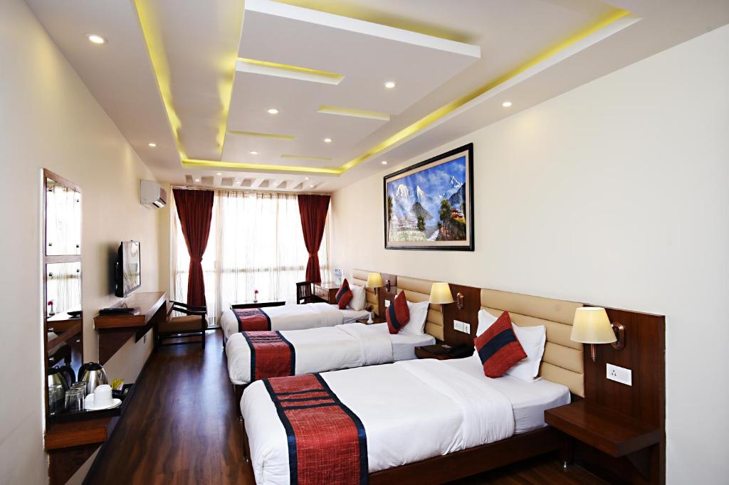 Postel nebo postele na pokoji v ubytování Hotel Jampa