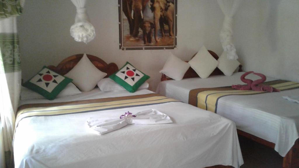 Postel nebo postele na pokoji v ubytování Kalana Homestay