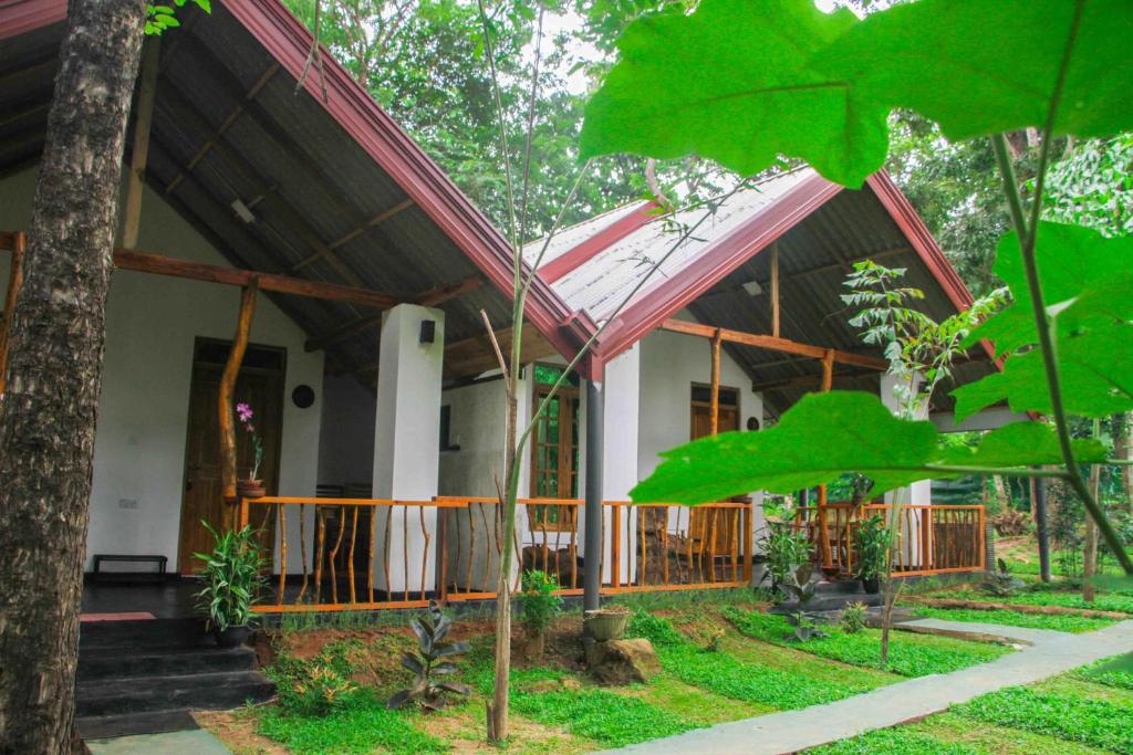 a house in the middle of a forest at Victory Villa Sigiriya in Sigiriya