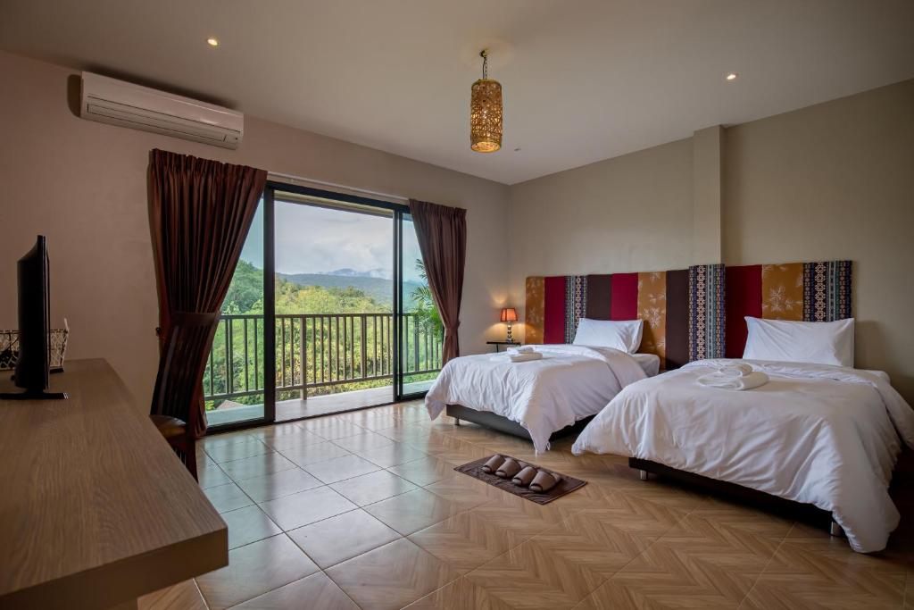 Postel nebo postele na pokoji v ubytování Thanburi resort