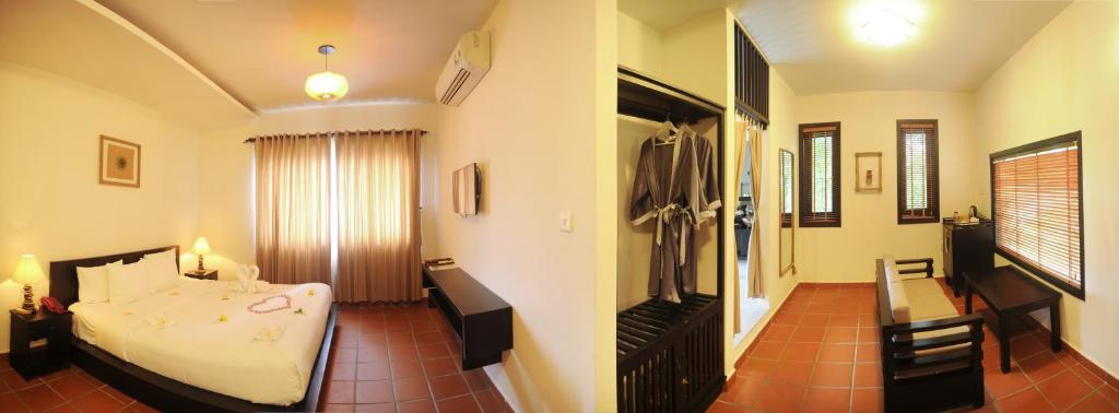 Postel nebo postele na pokoji v ubytování East West Villa