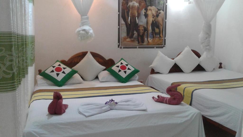 Postel nebo postele na pokoji v ubytování Kalana Homestay