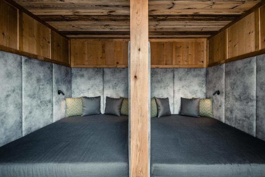Postel nebo postele na pokoji v ubytování Hotel Gran Ciasa