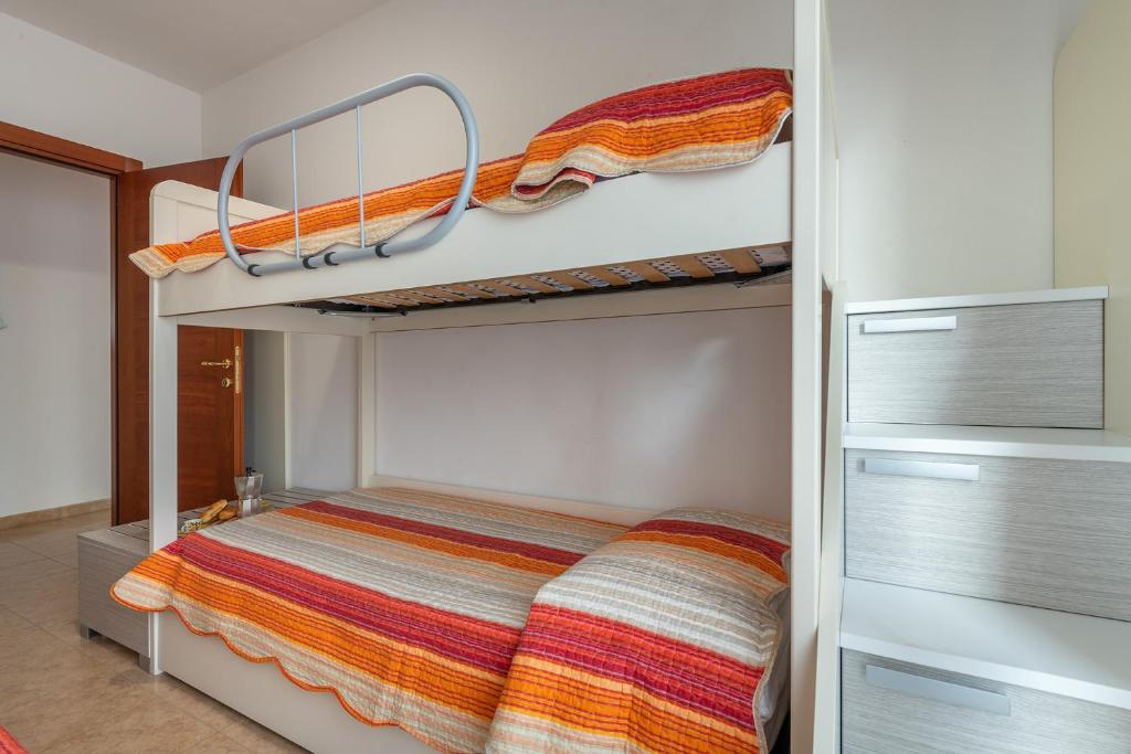 A bed or beds in a room at Trilo Gemelli 1