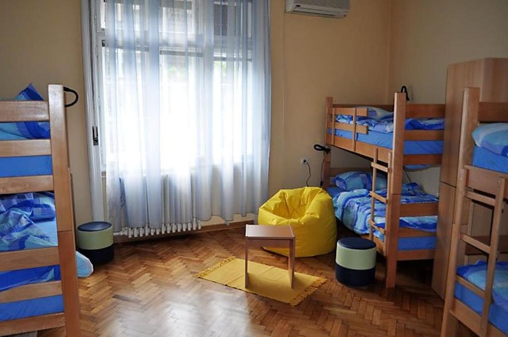 Uma cama ou camas num quarto em Habitat Hostel