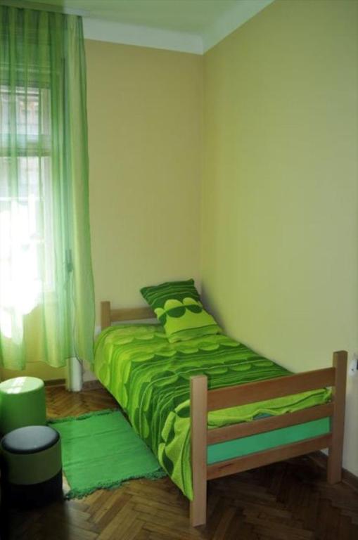 Uma cama ou camas num quarto em Habitat Hostel