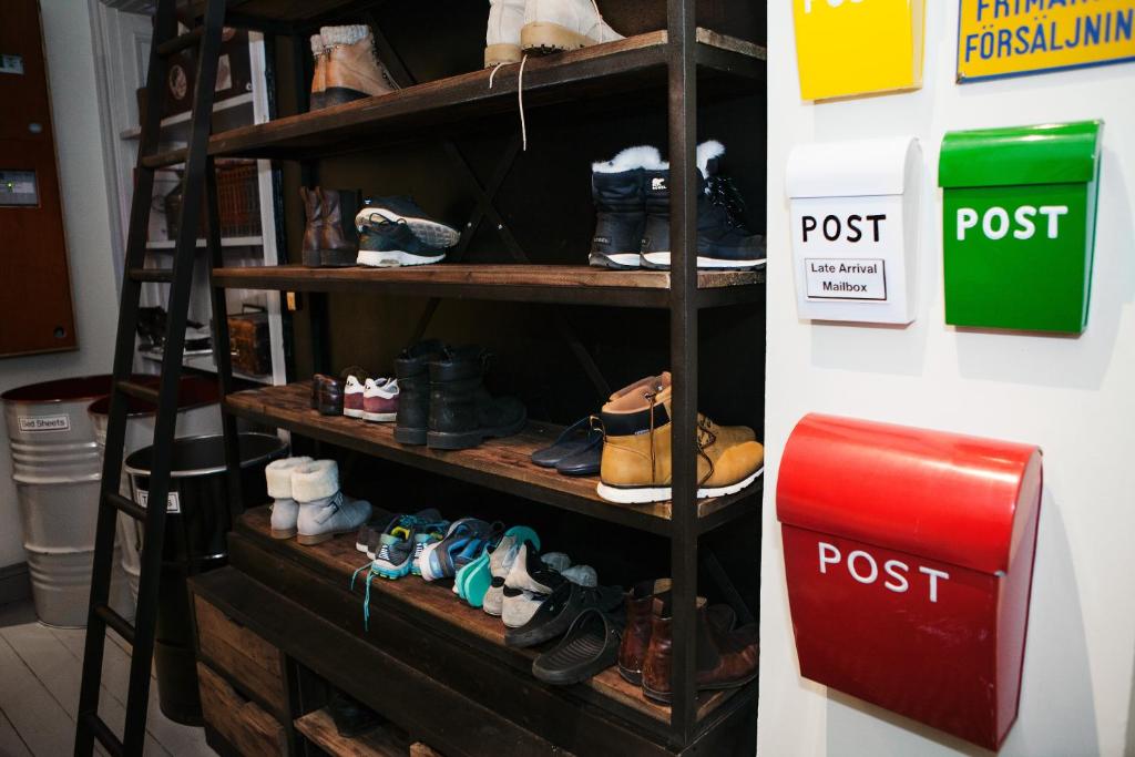 a shelf filled with lots of shoes in a store at City Backpackers Hostel in Stockholm