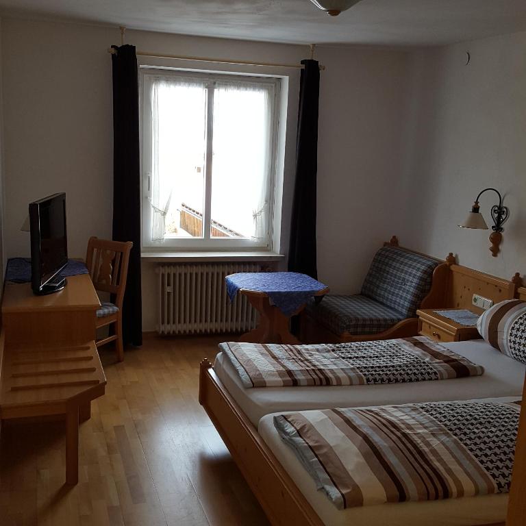 Postel nebo postele na pokoji v ubytování Lenggrieser Hof