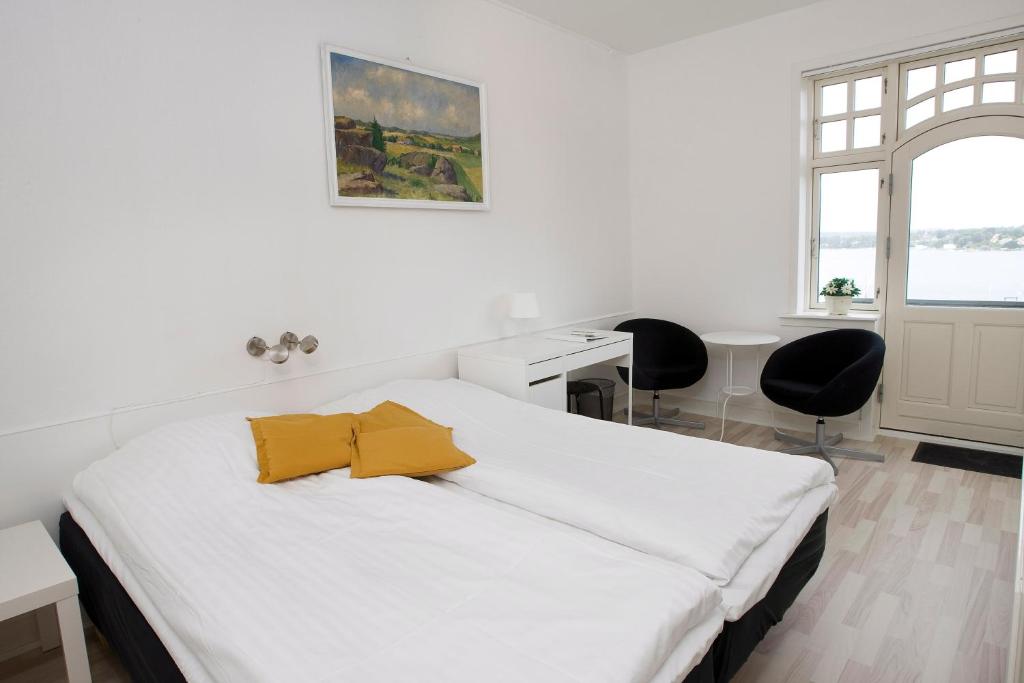 Postel nebo postele na pokoji v ubytování Hotel Troense