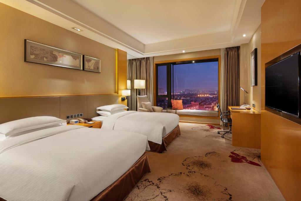 Postel nebo postele na pokoji v ubytování Wyndham Shanghai Nanxiang