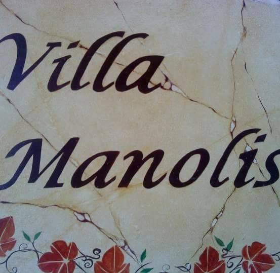a sign with the word villa marques written on it at Villa Manolis in Tolo