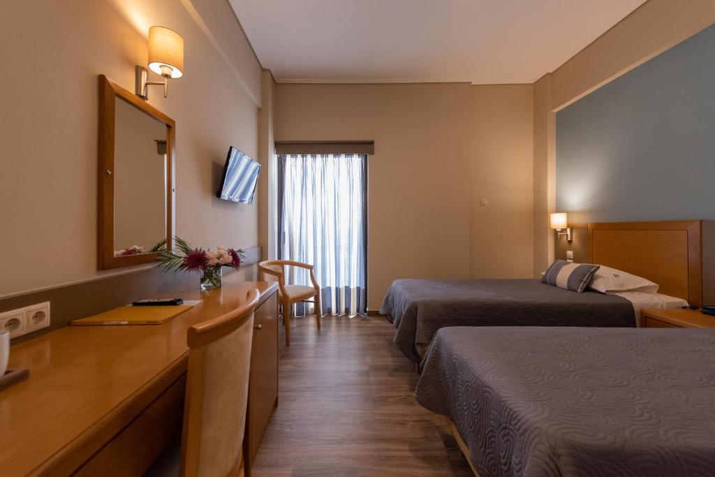 Postel nebo postele na pokoji v ubytování Hotel Ostria