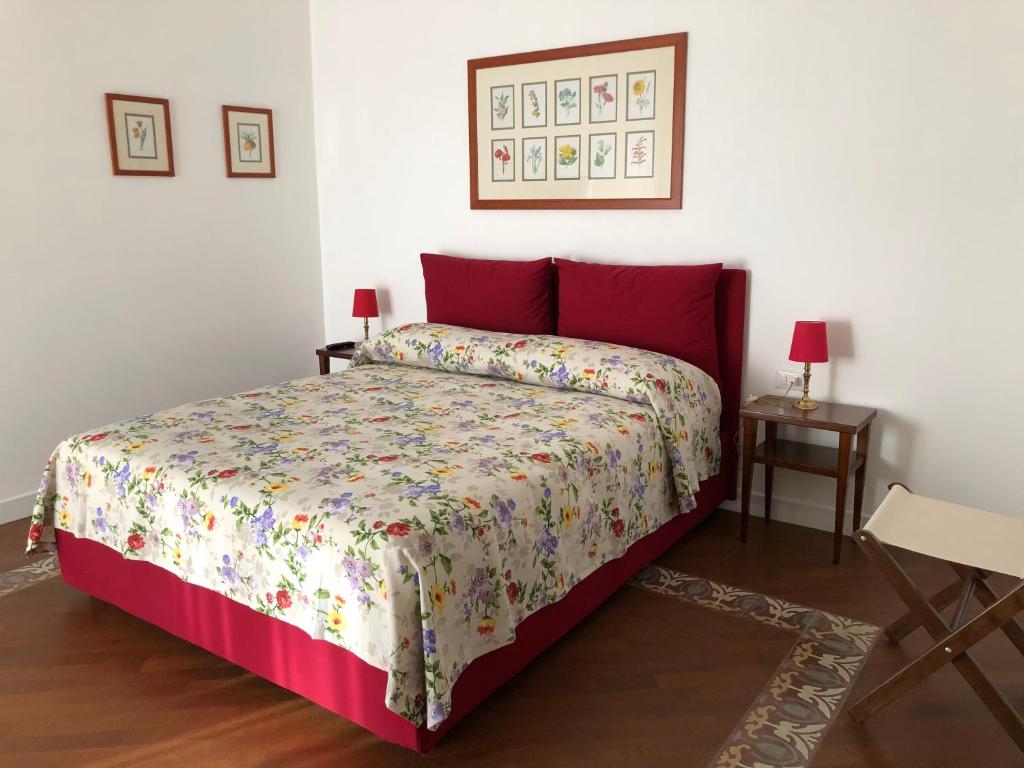 Postel nebo postele na pokoji v ubytování All'Angolo B&B