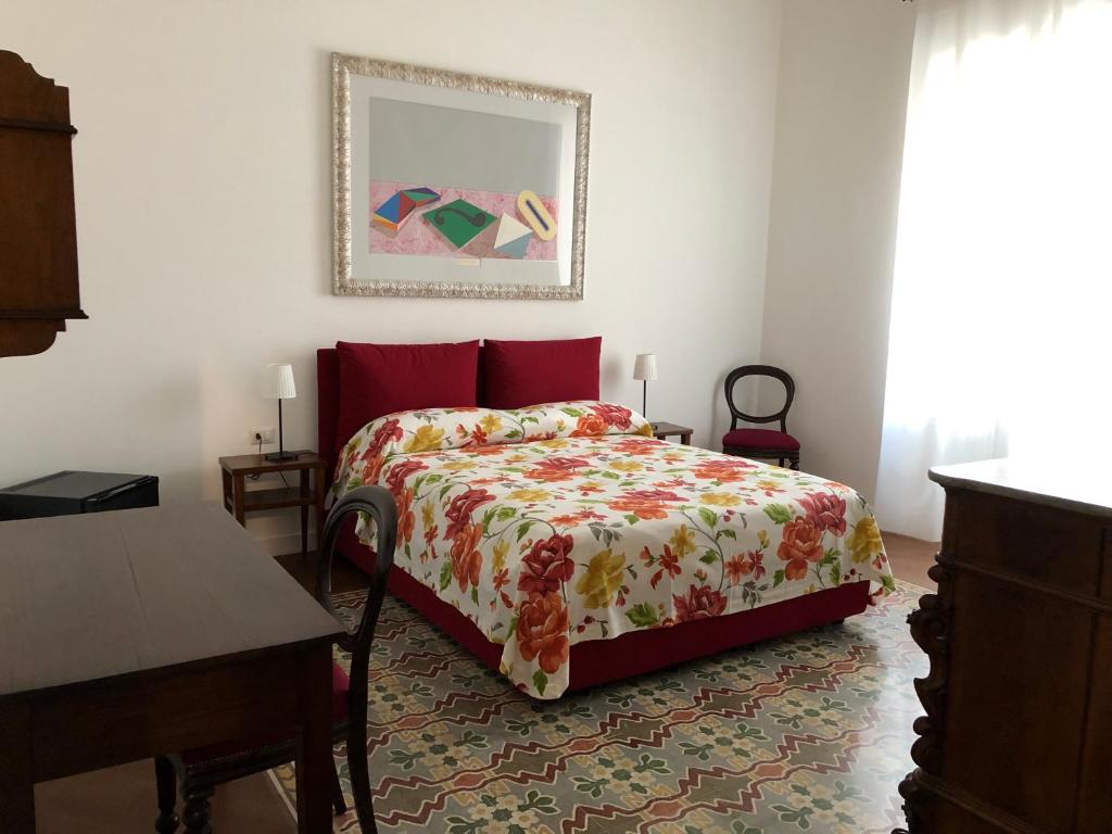 Postel nebo postele na pokoji v ubytování All'Angolo B&B