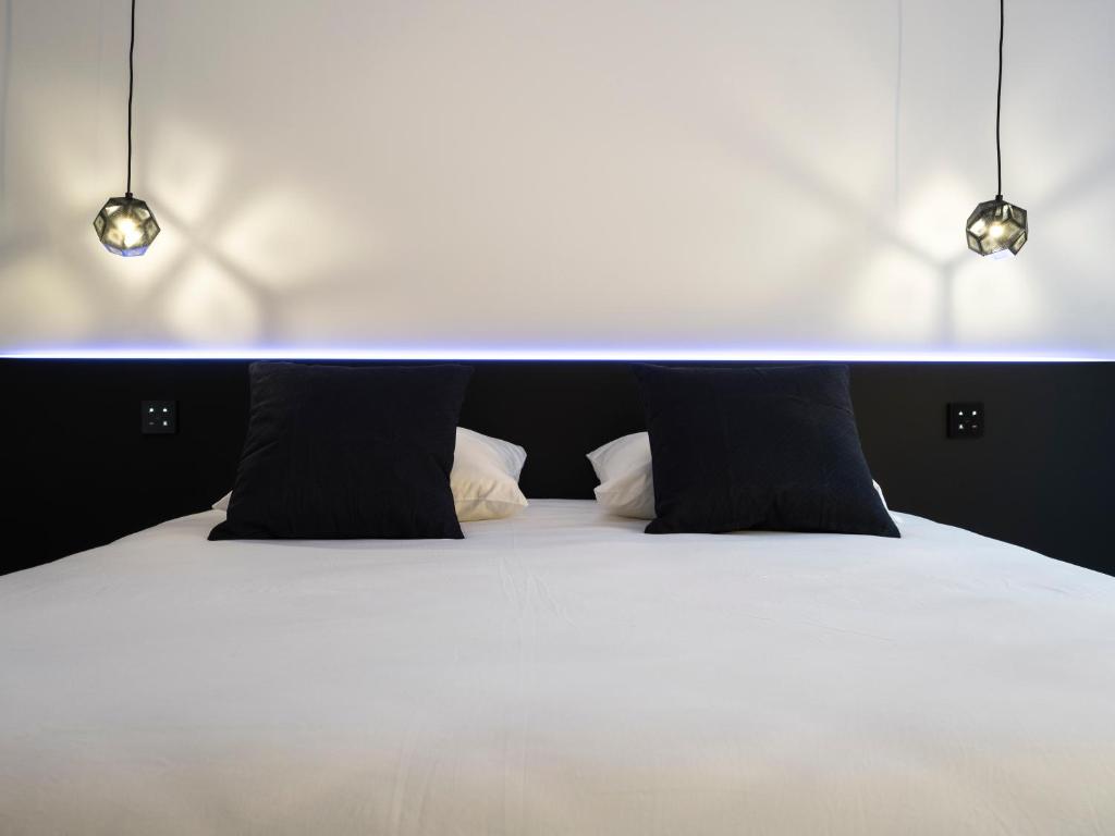 Postel nebo postele na pokoji v ubytování MiHotel Vieux Lyon