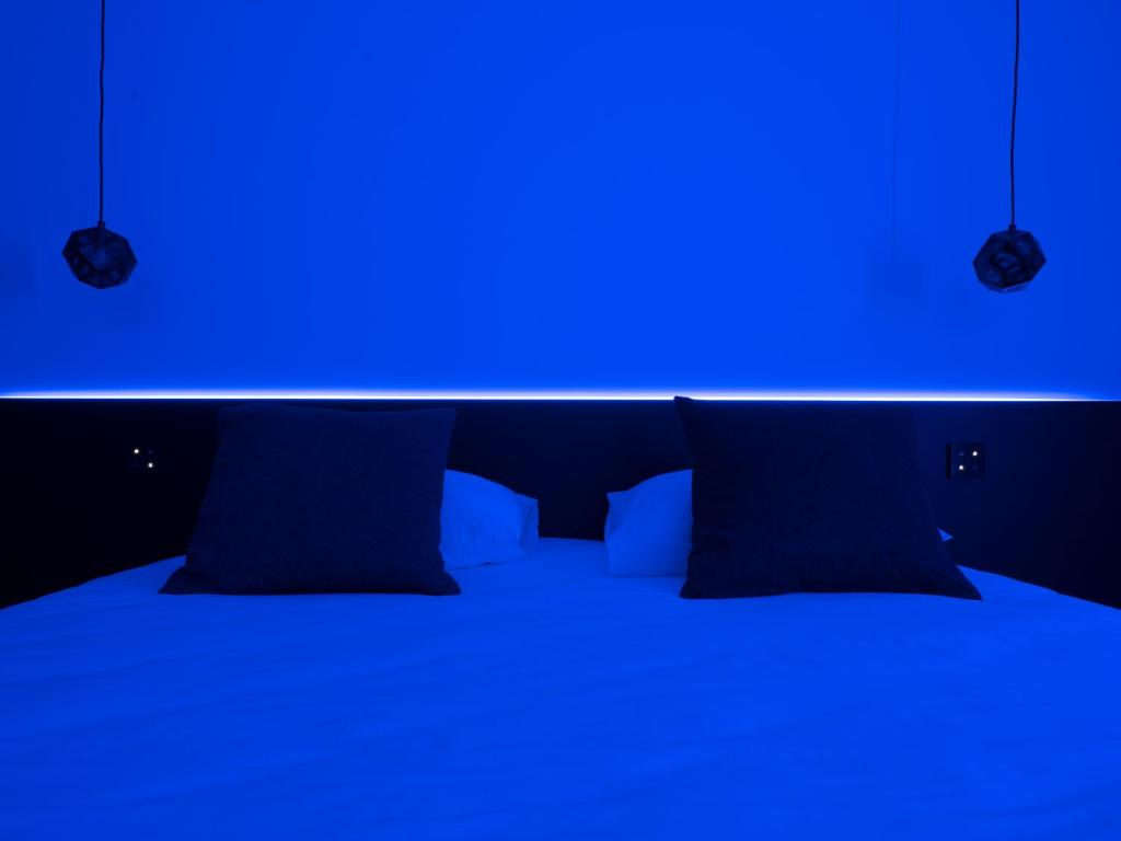 Postel nebo postele na pokoji v ubytování MiHotel Vieux Lyon