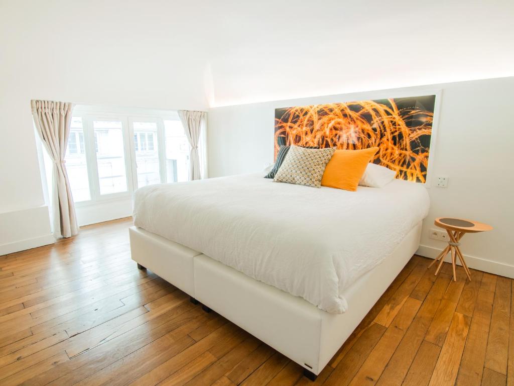 Postel nebo postele na pokoji v ubytování MiHotel Comte