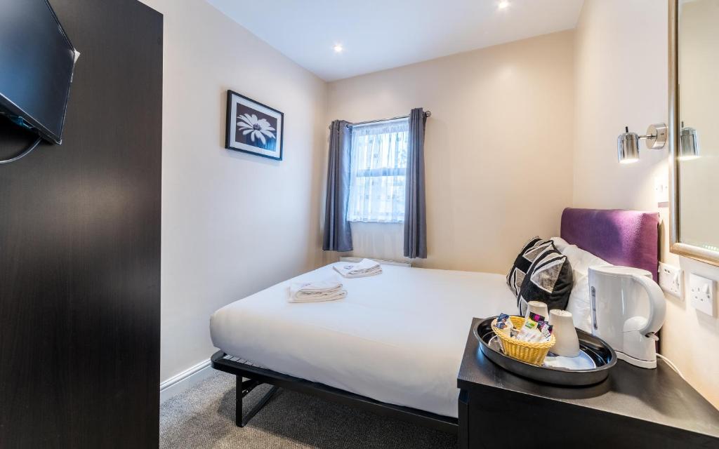 Postel nebo postele na pokoji v ubytování Royal London Hotel By Saba