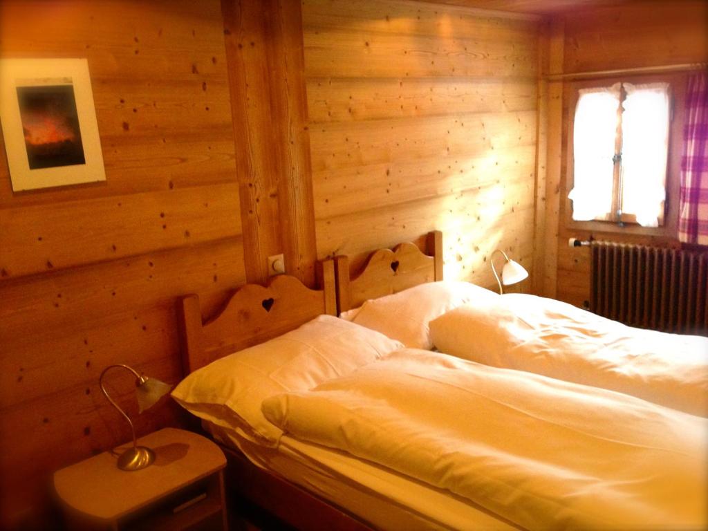 Letto o letti in una camera di Auberge de la poste