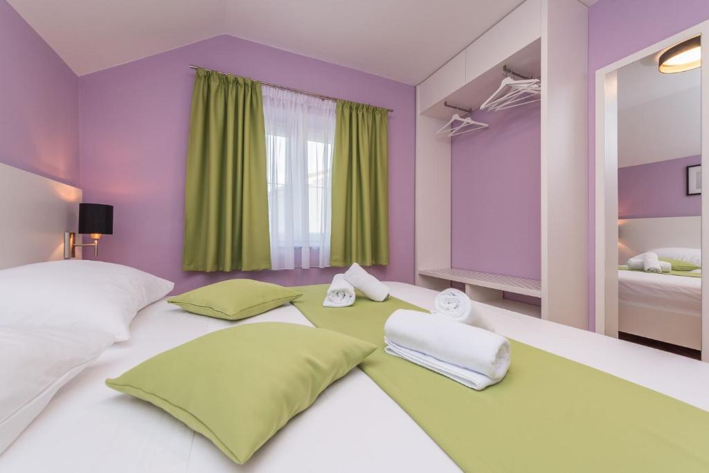 Postel nebo postele na pokoji v ubytování Villa Zdenka