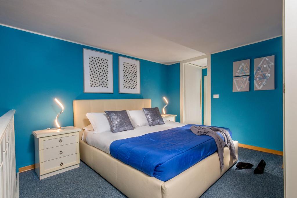 Llit o llits en una habitació de Navona Blue Apartment
