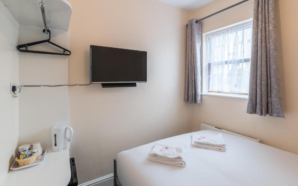Postel nebo postele na pokoji v ubytování Royal London Hotel By Saba
