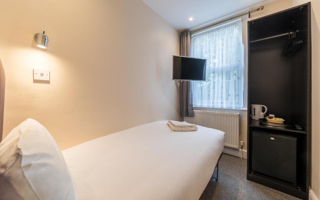 Postel nebo postele na pokoji v ubytování Royal London Hotel By Saba