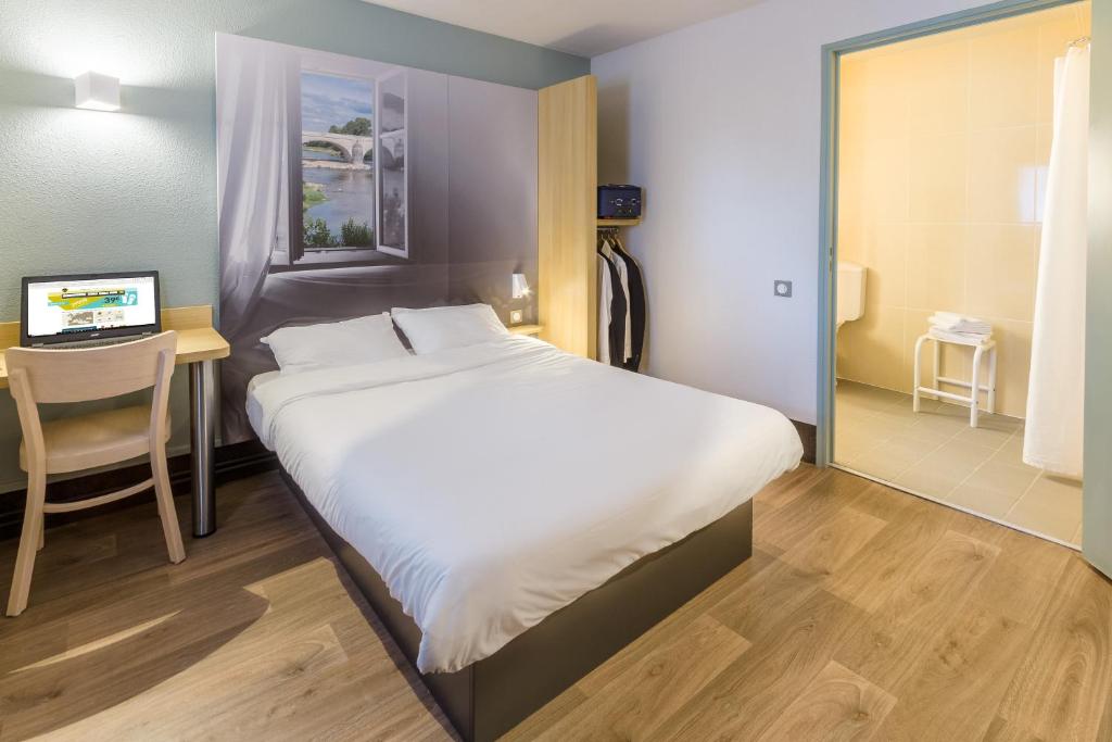 Postel nebo postele na pokoji v ubytování B&B HOTEL CAEN Sud