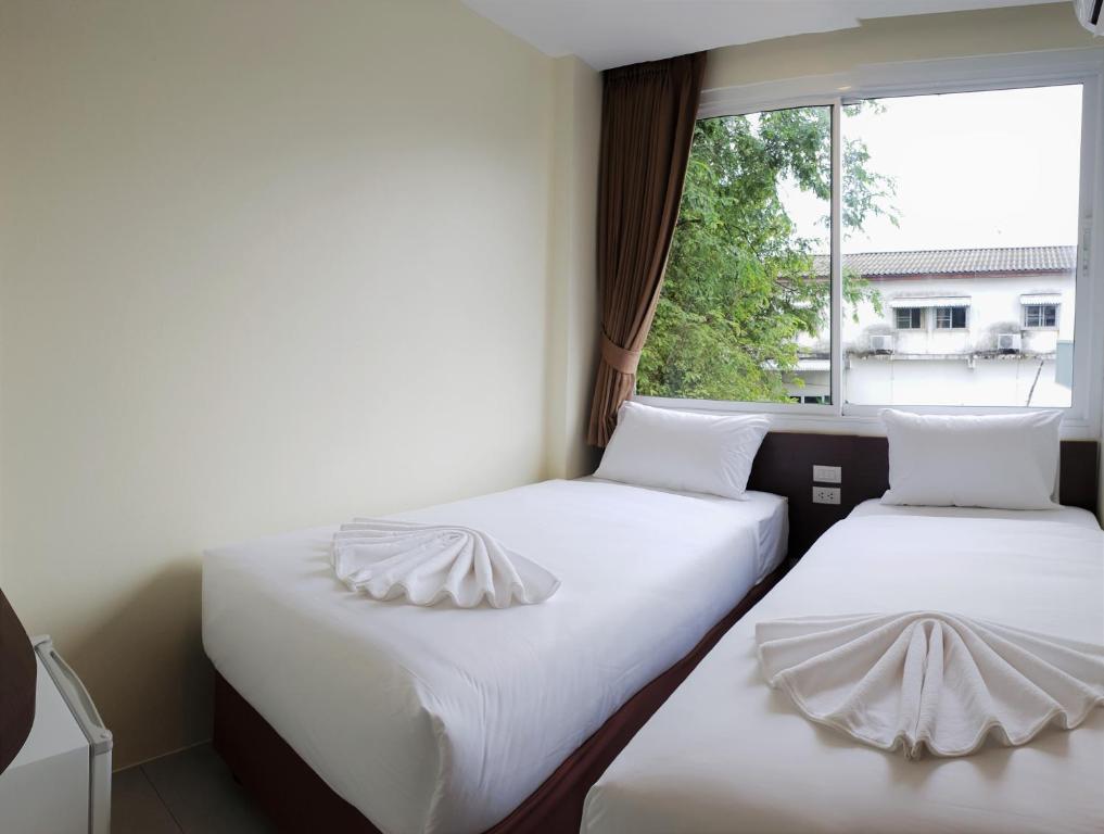 Postel nebo postele na pokoji v ubytování Top Hostel Samui