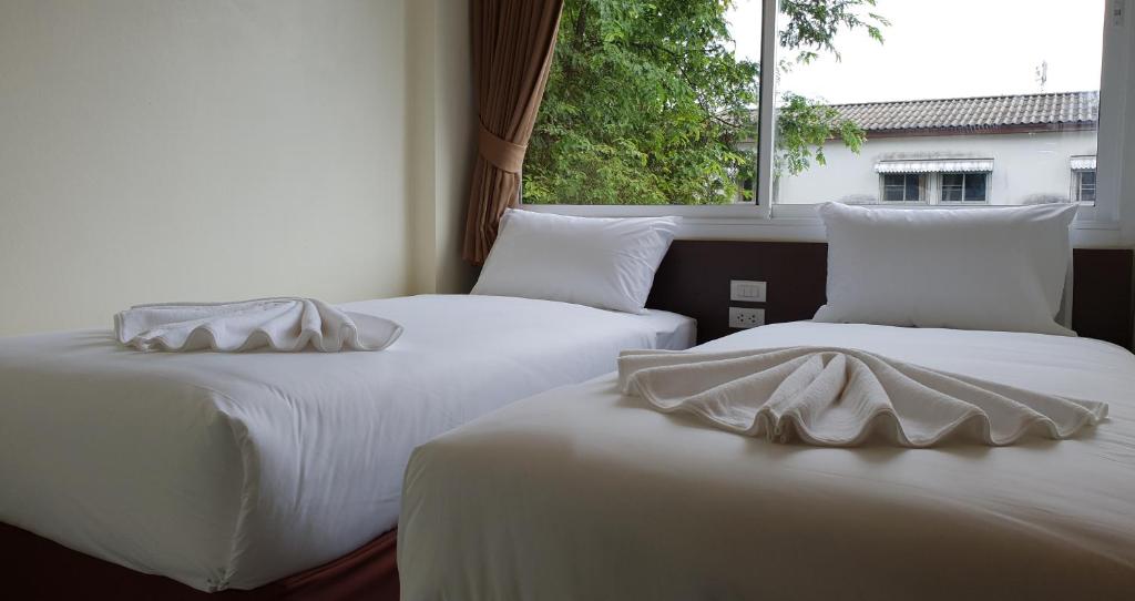 Postel nebo postele na pokoji v ubytování Top Hostel Samui