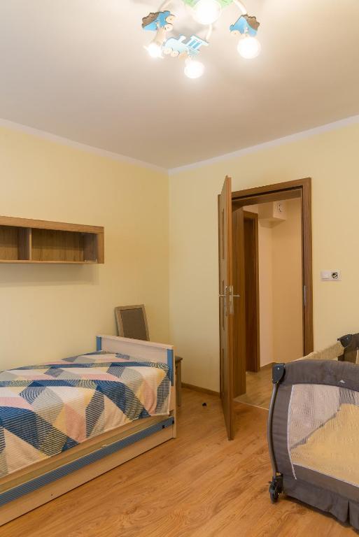 Postel nebo postele na pokoji v ubytování Apartament Na Urlop - Centrum - Przy Amfiteatrze - 500m do Basenów Wisła