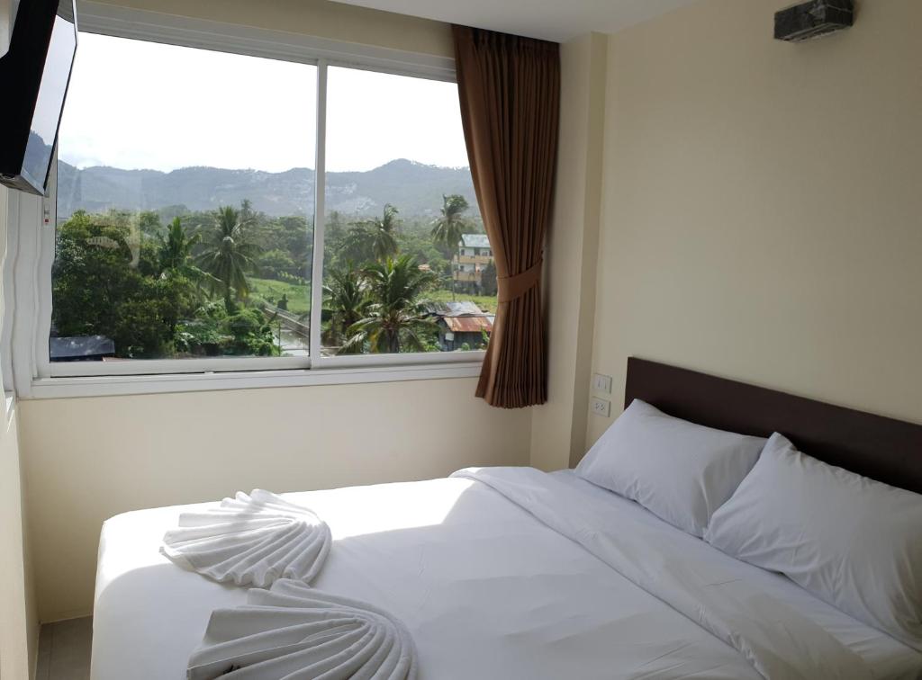 Postel nebo postele na pokoji v ubytování Top Hostel Samui