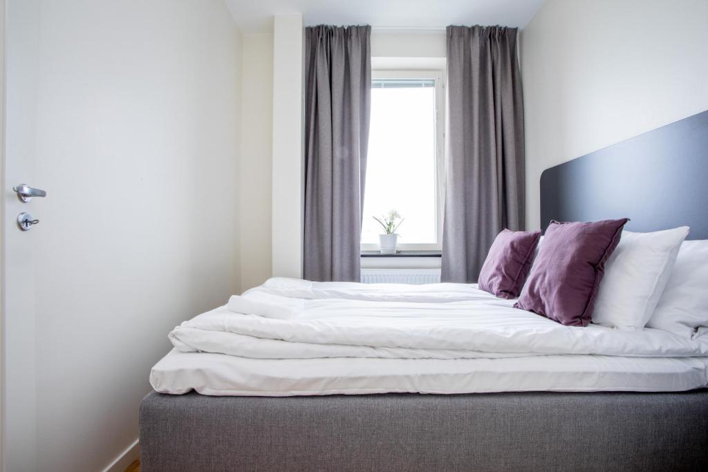 Postel nebo postele na pokoji v ubytování ApartDirect Linköping Arena